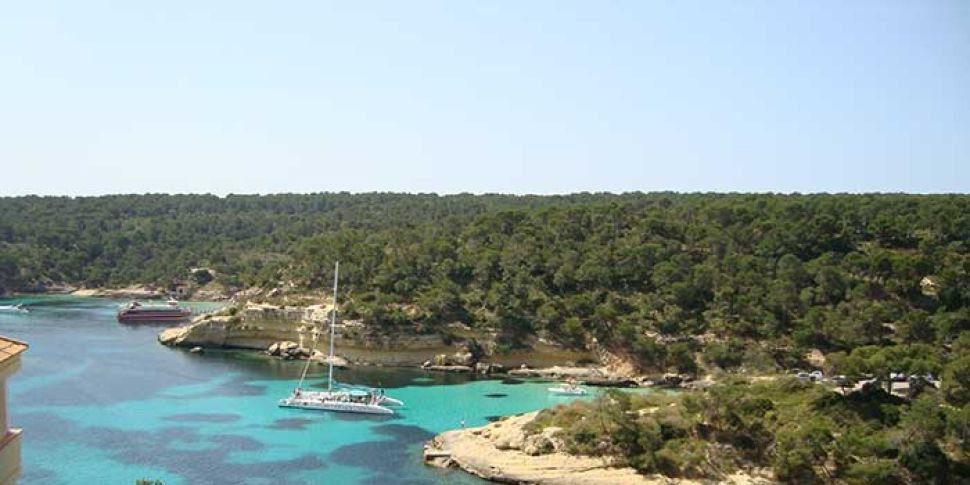 boat docked in a sandy bay